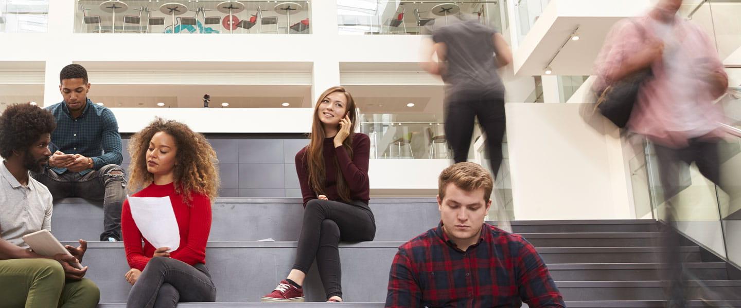 a group of people sitting on a bench